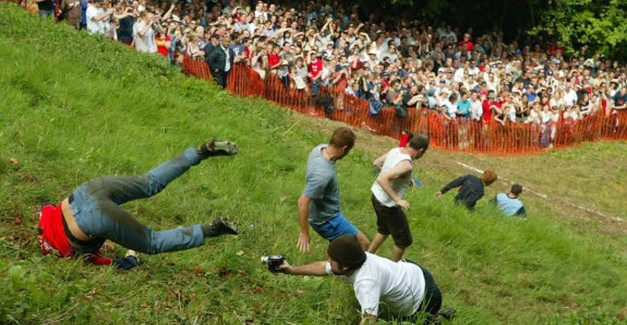 Head over heals for Cheese Rolling Cheese Rolling, Cheese Rolling Festival, Gloucestershire Cheese Rolling, Coopers Hill Wacky UK Festivals